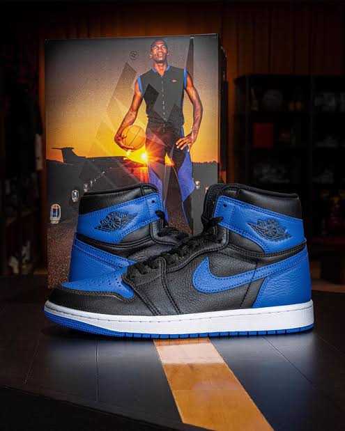 Air Jordan 1 Royal black and blue leather sneakers with Michael Jordan runway photo backdrop